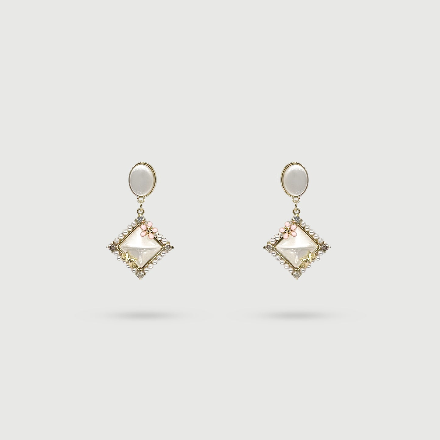 Boucles d'oreilles étoile avec fleur rose