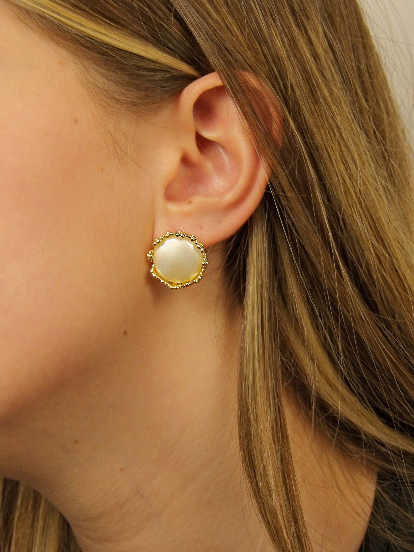 Large pearl earrings with golden flowers around