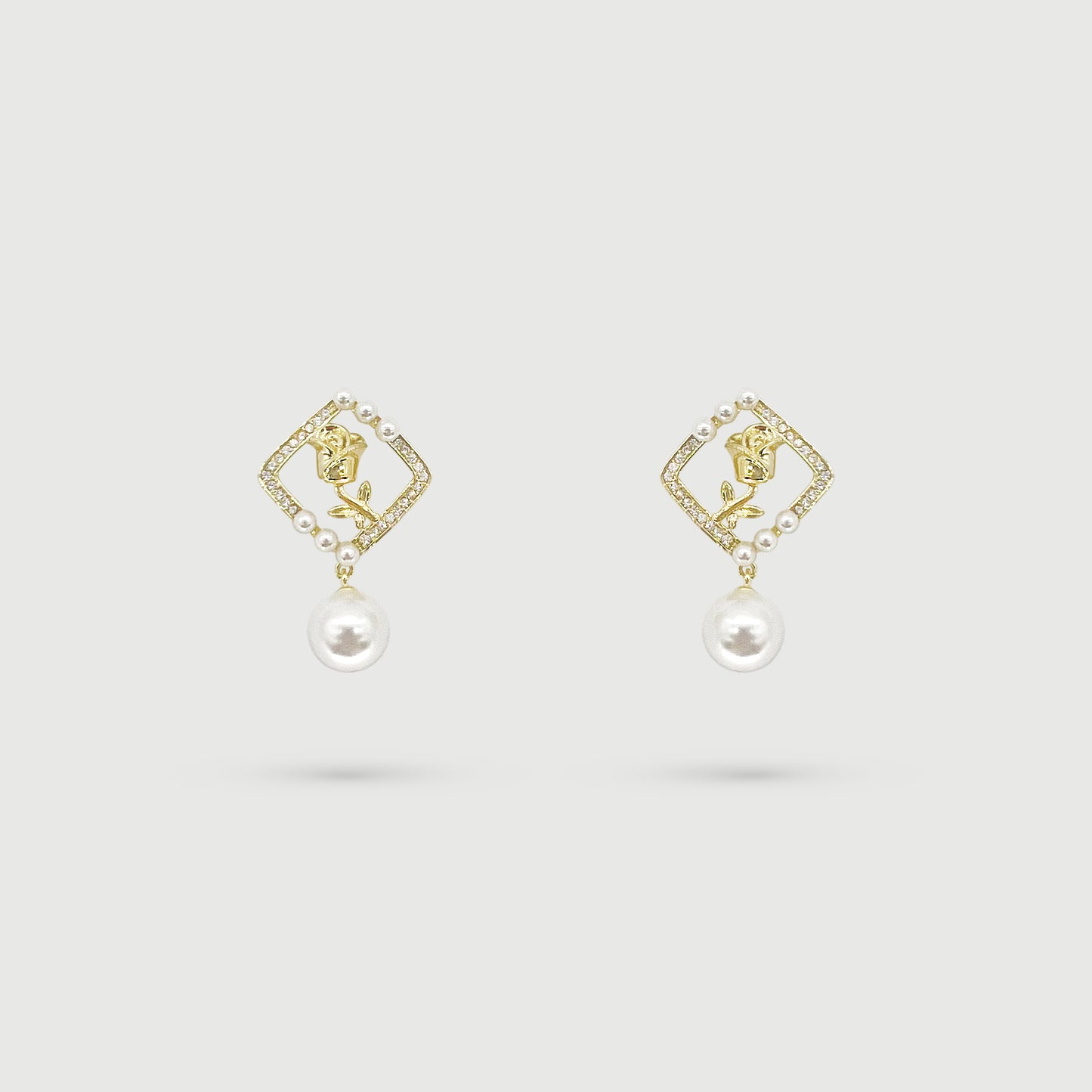 Boucles d'oreilles dorées et rose avec perle