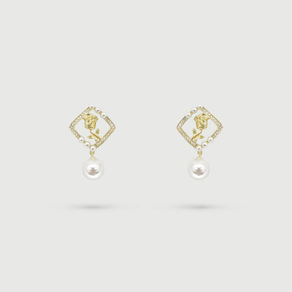 Boucles d'oreilles dorées et rose avec perle