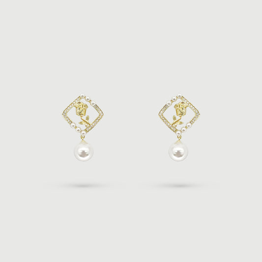 Boucles d'oreilles dorées et rose avec perle